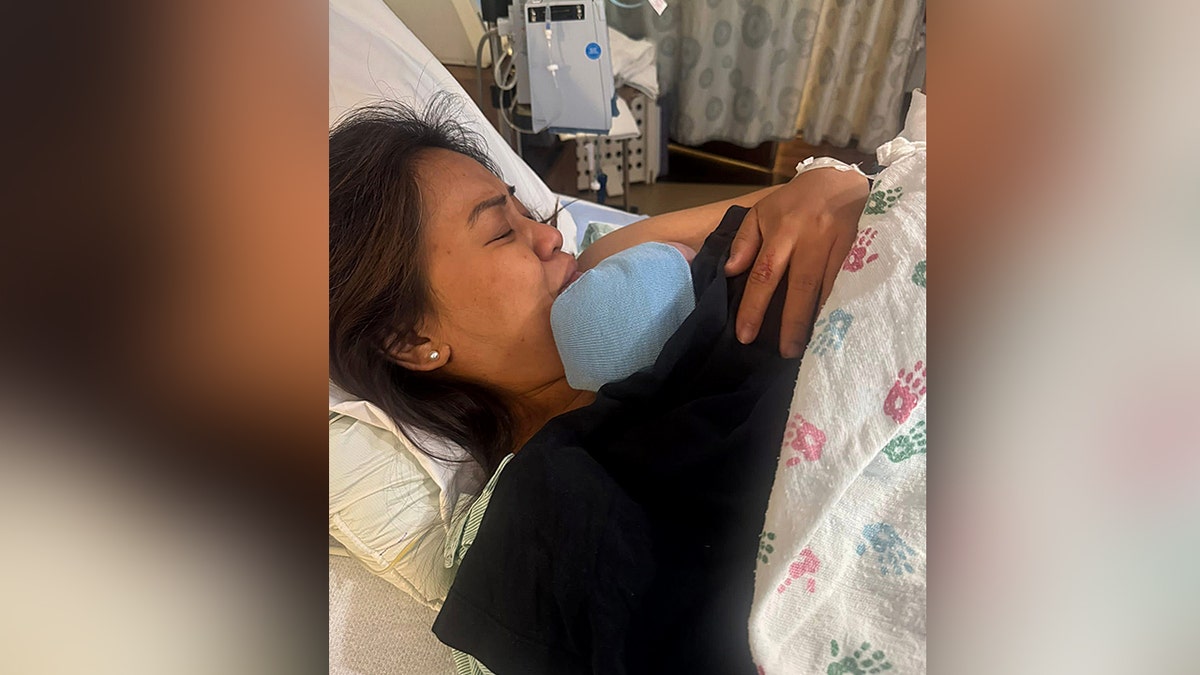 Mark Arceta's girlfirend and their newborn baby