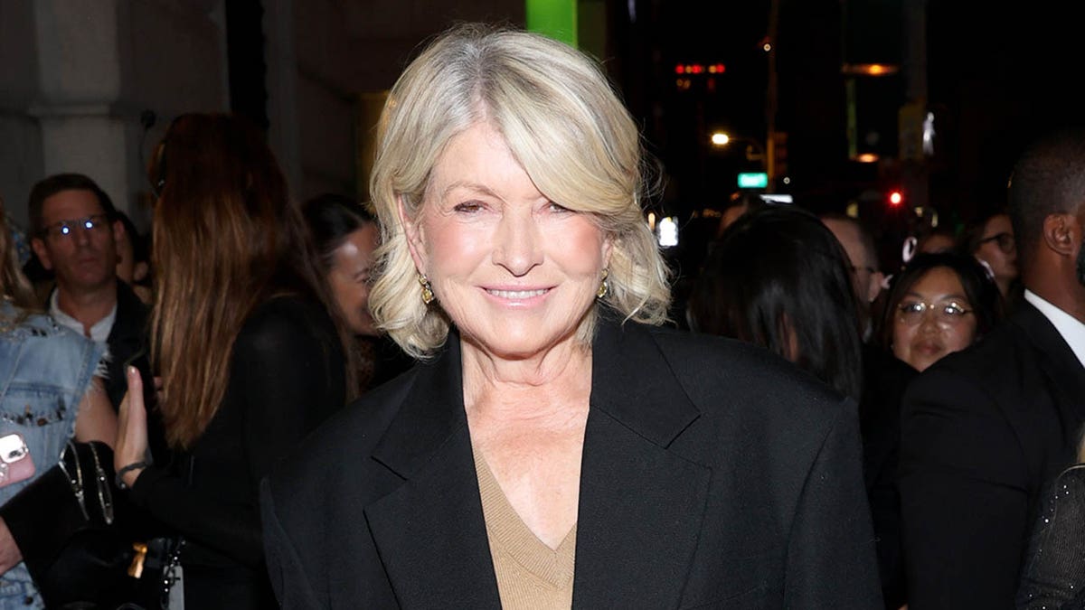 Martha Stewart smiles while walking in NYC. 