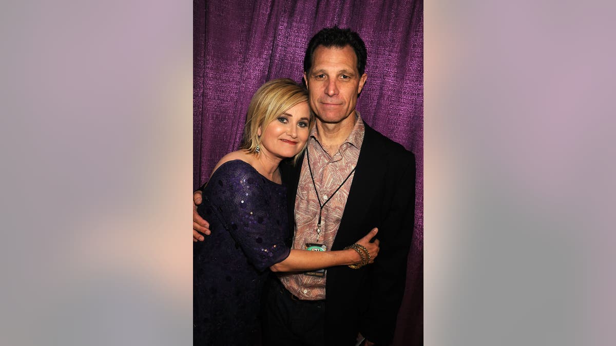 Maureen McCormick embracing her husband Michael Cummings.