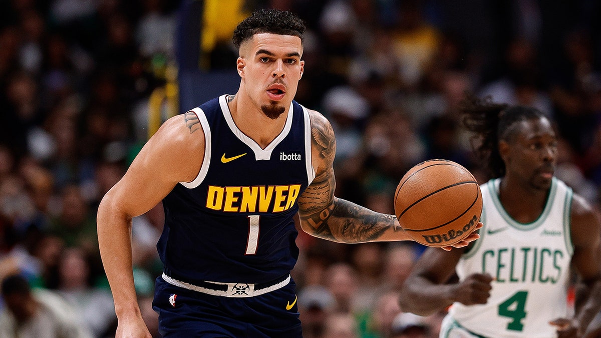 Michael Porter Jr. dribbles the ball