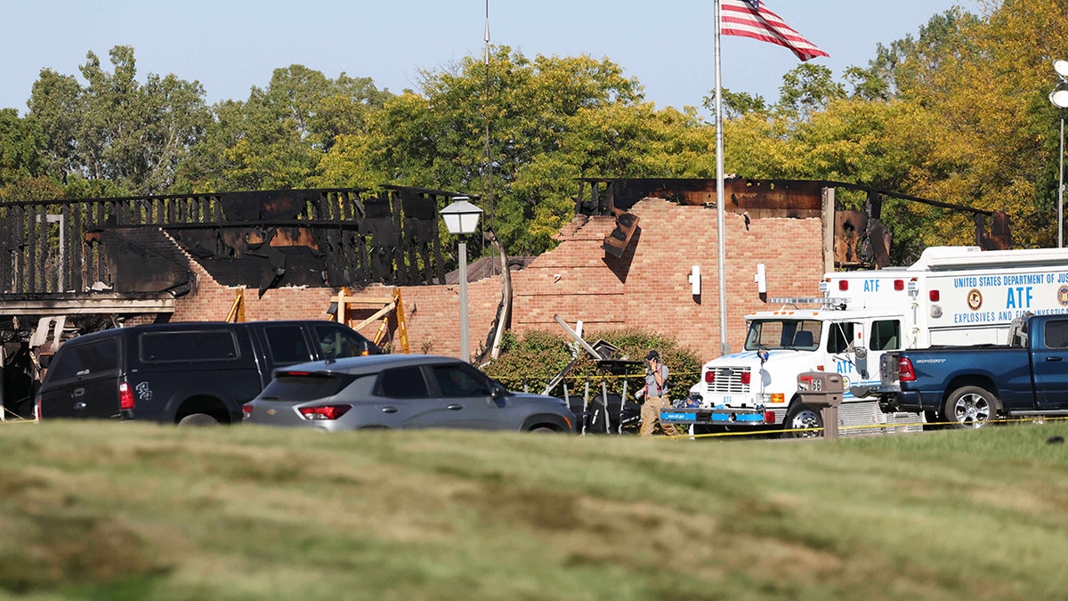 Police vehicles gather outside scene of Michigan church shooting