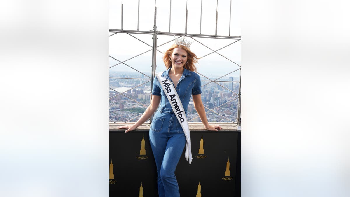 Miss America smiling with New York City behind her.