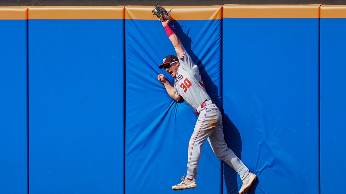 Jacob Young makes a catch in late-season action