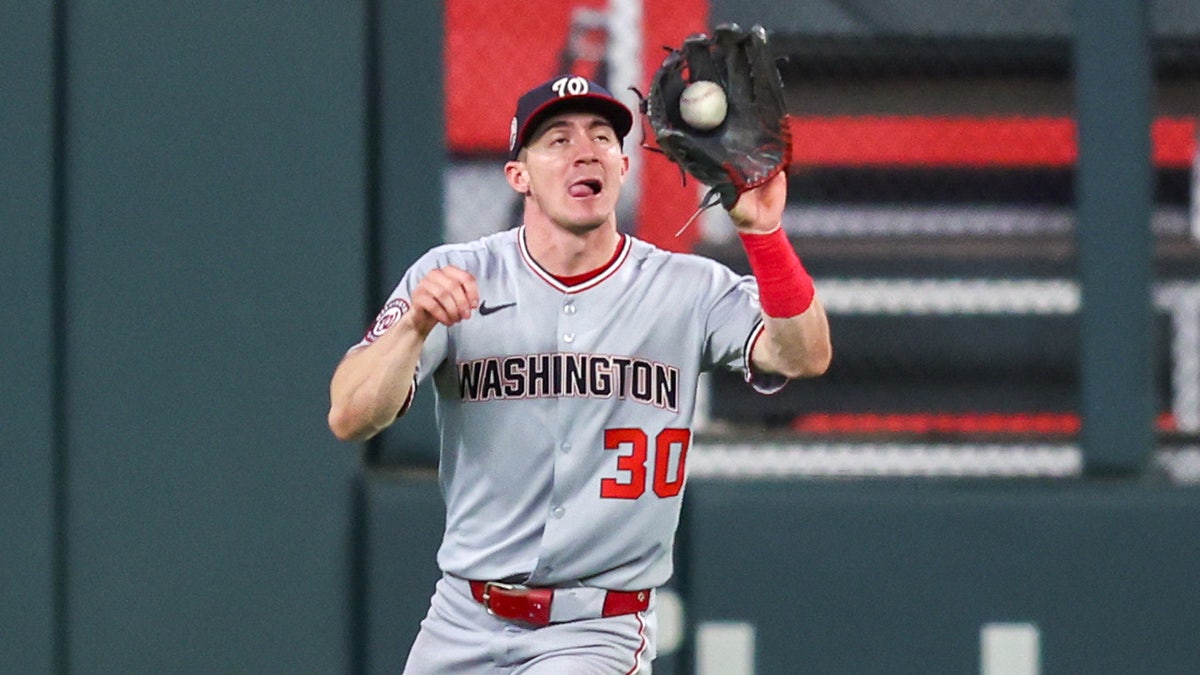 Young leaps for a ball in center field