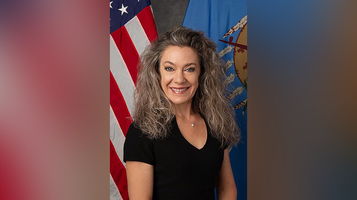 Bree Montoya official portrait with U.S. and Oklahoma flags