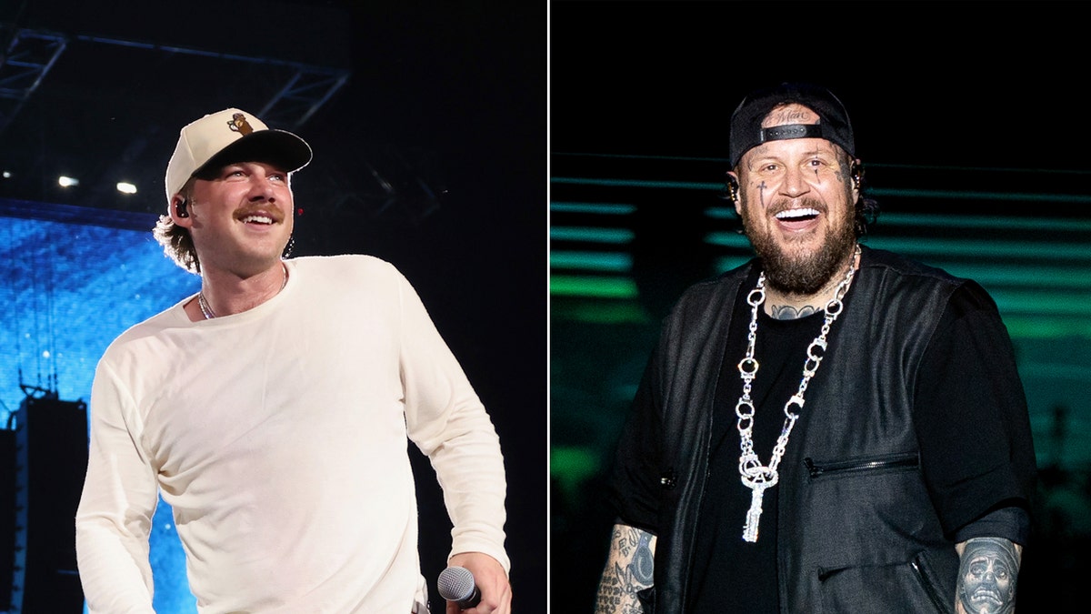 Morgan Wallen wears hat and white shirt on stage next to Jelly Roll in all black.