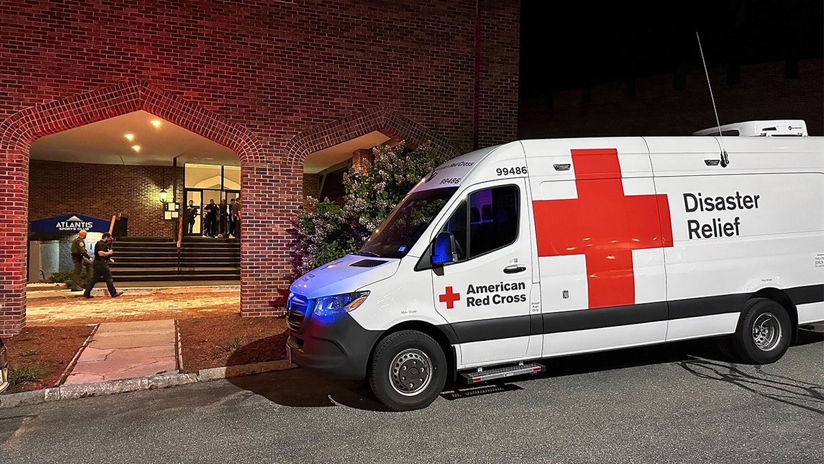 Red Cross vehicle outside hotel used for reunification after New Hampshire shooting