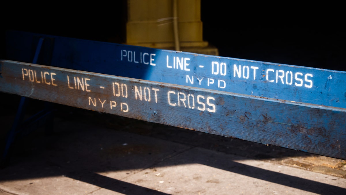 An NYPD "Police Line Do Not Cross" sign