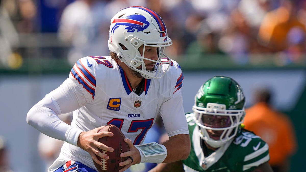Josh Allen wearing the ball