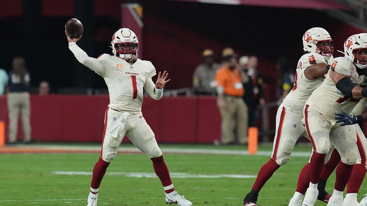 Kyler Murray throws a football