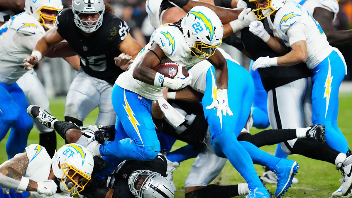Najee Harris runs