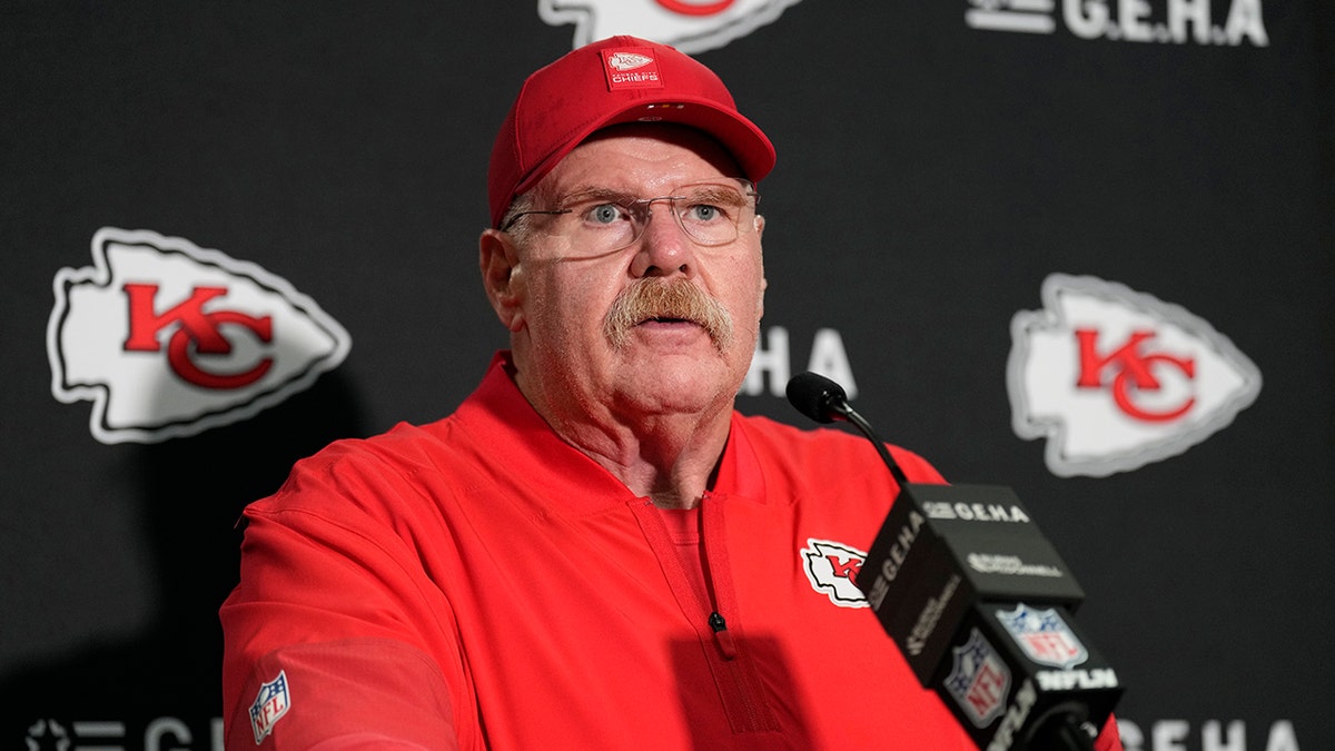 Andy Reid talks to reporters