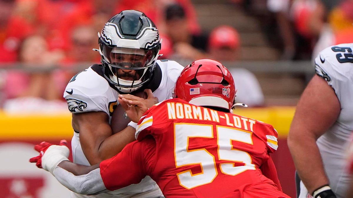 Jalen Hurts carries the ball