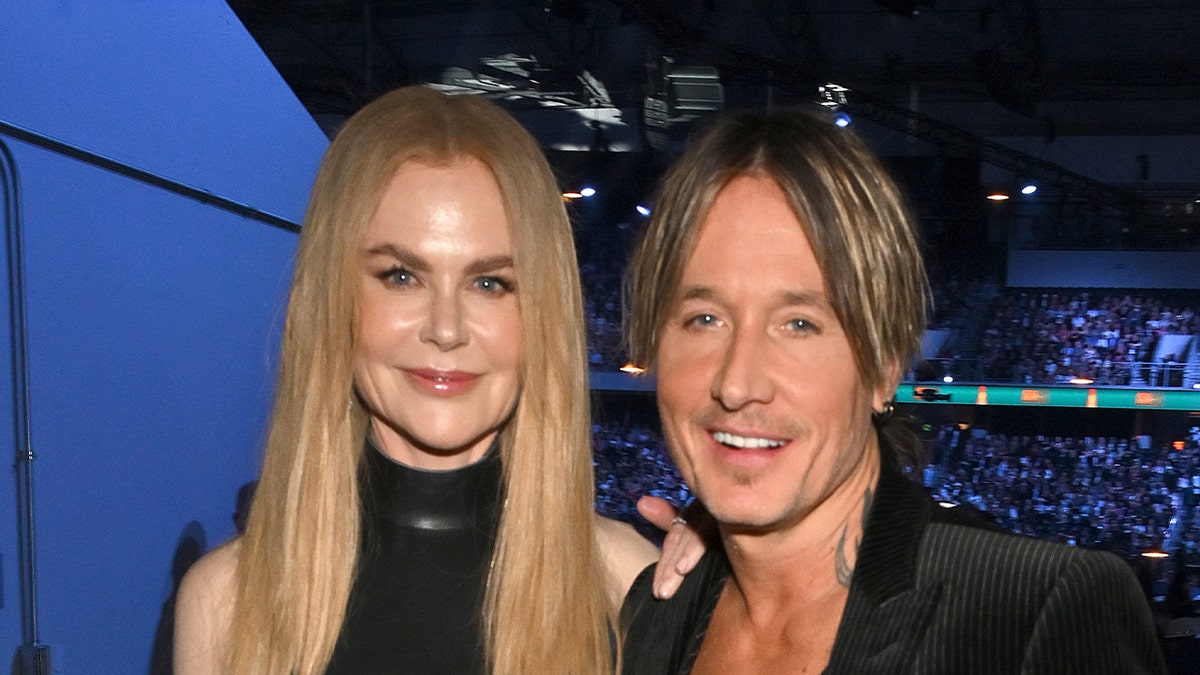 Nicole Kidman smiles next to Keith Urban