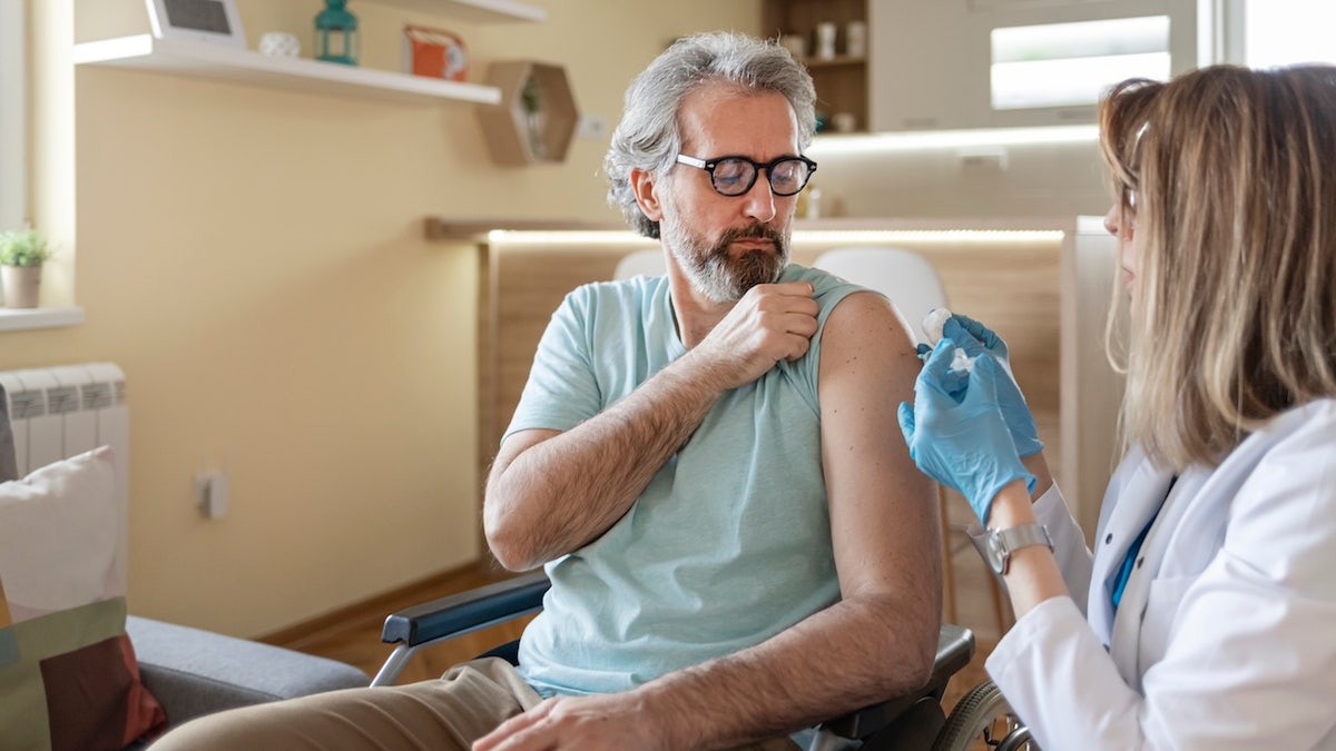 Older man getting vaccinated