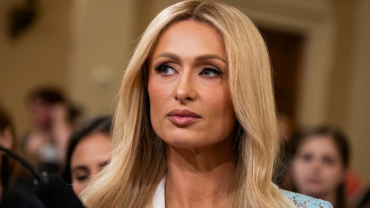 A close-up of Paris Hilton looking serious as she testifies.