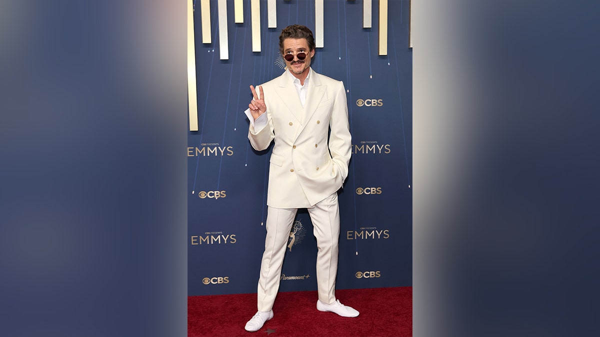 Pedro Pascal in a white suit at the Emmy Awards.