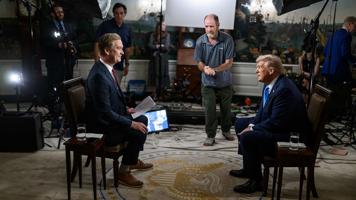 President Donald Trump seated across from Fox News' Peter Doocy