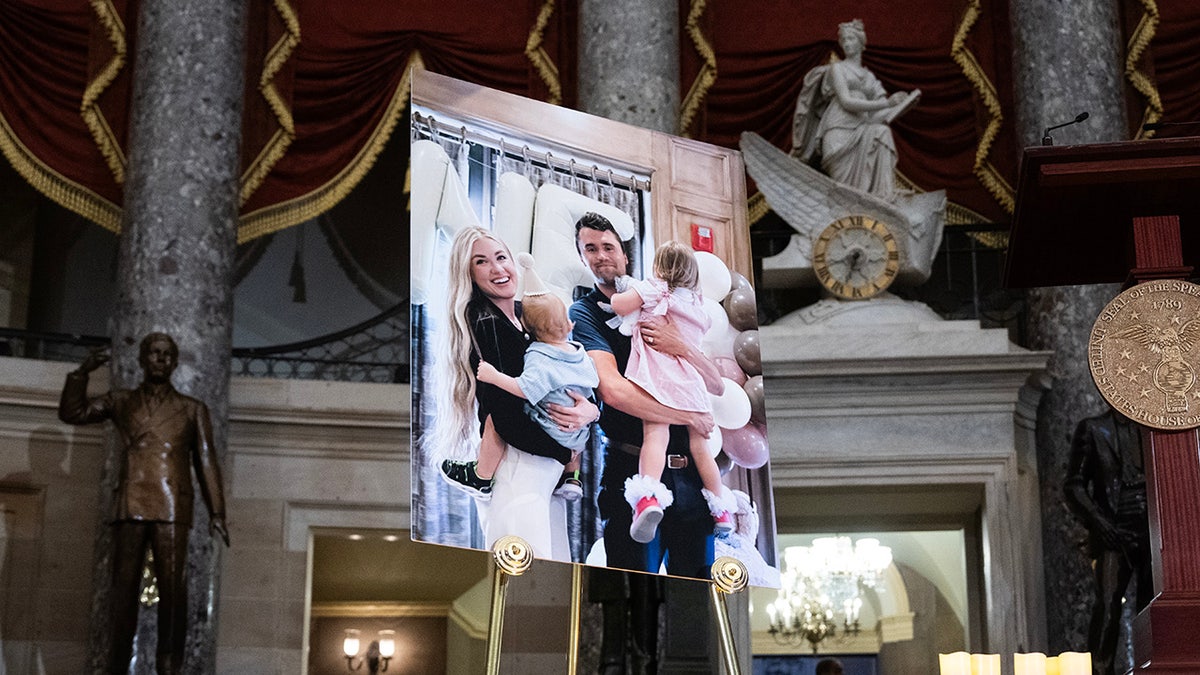 A photo of Charlie Kirk with his family at his memorial