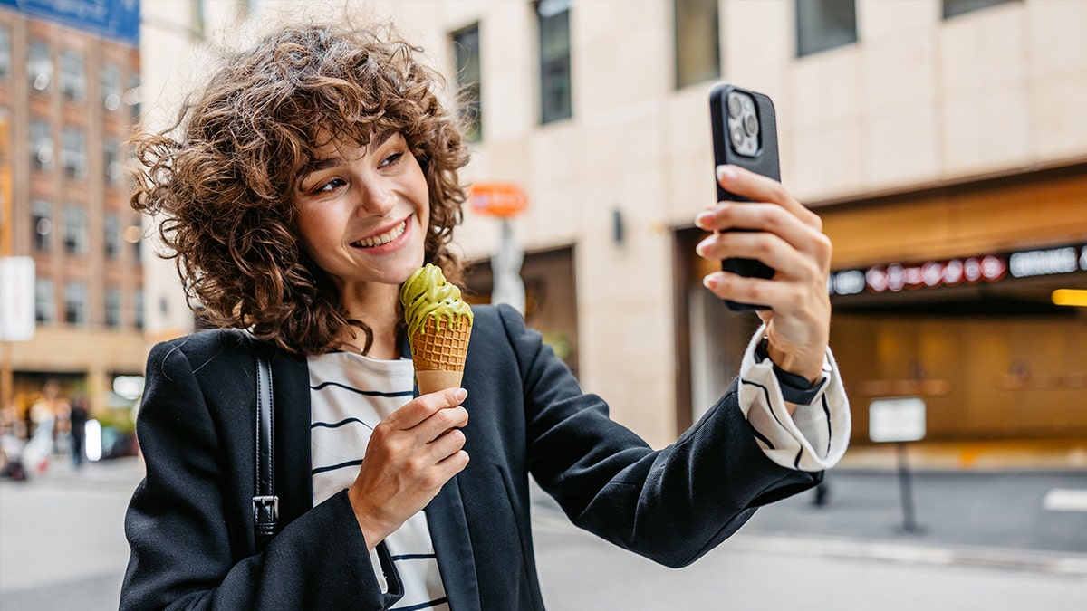 Woman eating pistachio ice cream