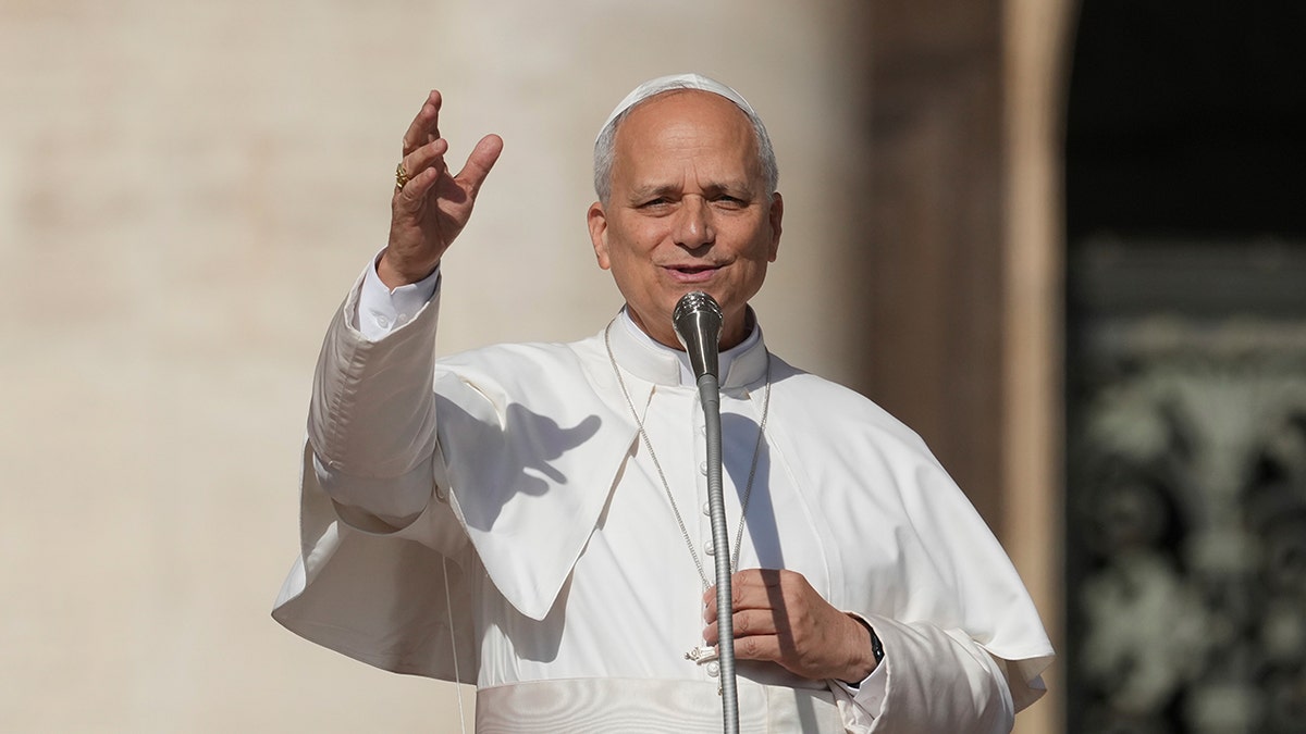 Pope Leo XIV raises hands to the crowd in St. Peter's Square