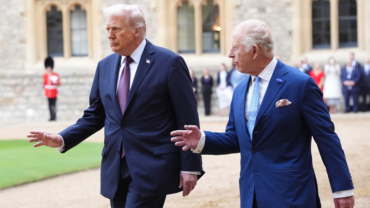 President Donald Trump and King Charles walking together and talking.