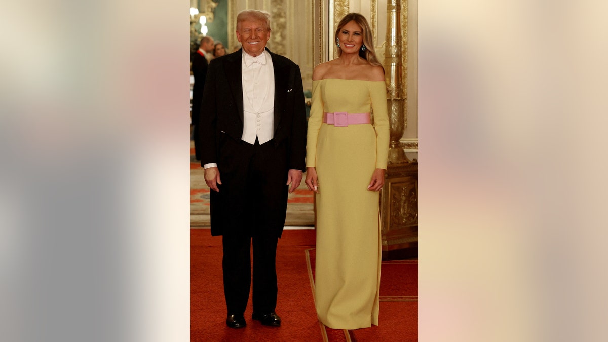 Donald Trump and Melania Trump posing for a photo at St. George's Hall.