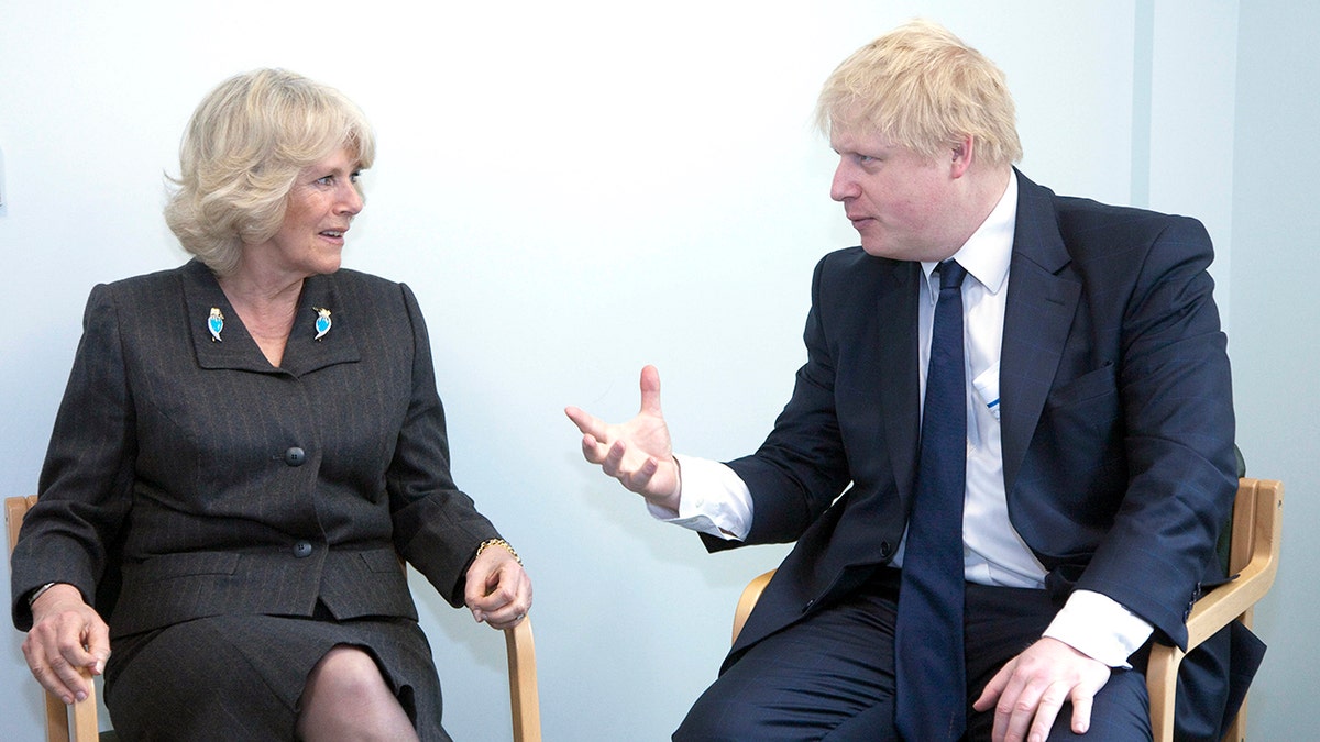 Queen Camilla chatting with Boris Johnson.