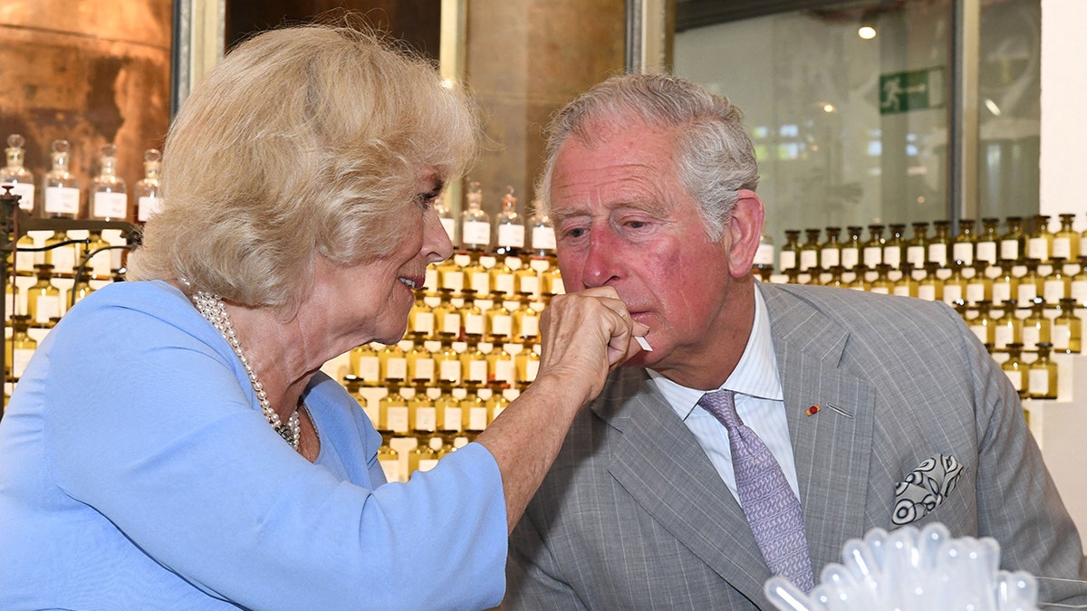 Queen Camilla shares a perfume with King Charles to smell.