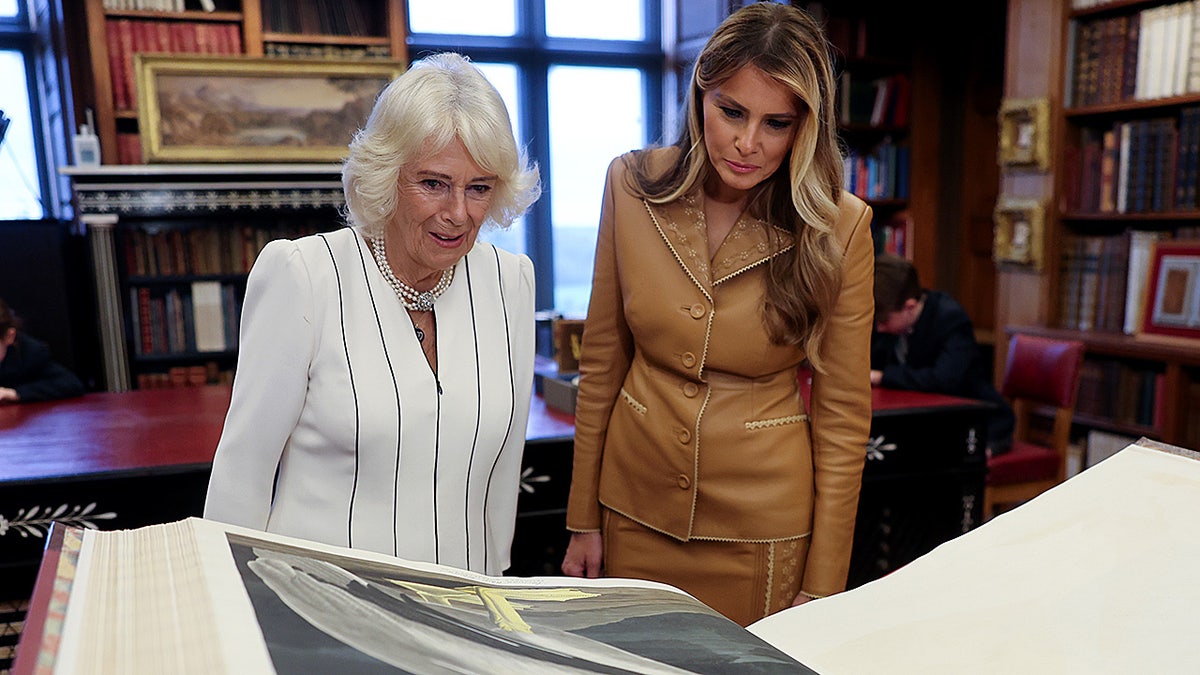 Queen Camilla and Melania Trump looking at art