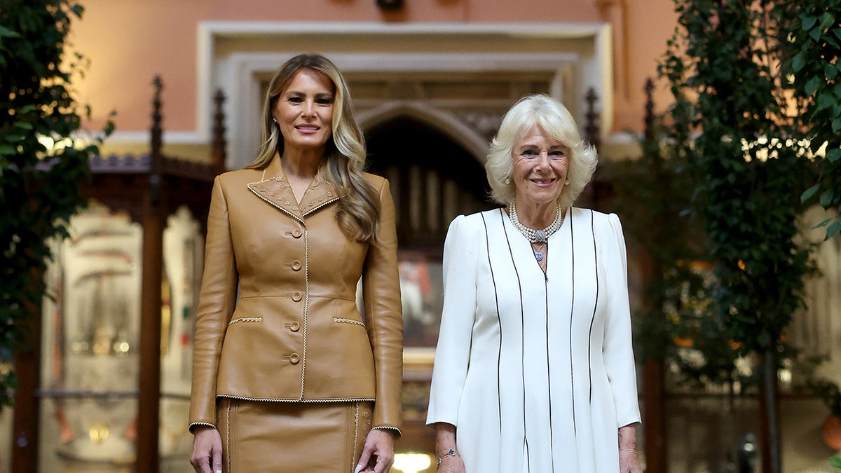 Melania Trump standing shoulder to shoulder with Queen Camilla.
