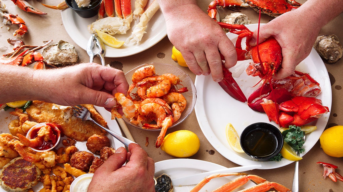People eat seafood feast