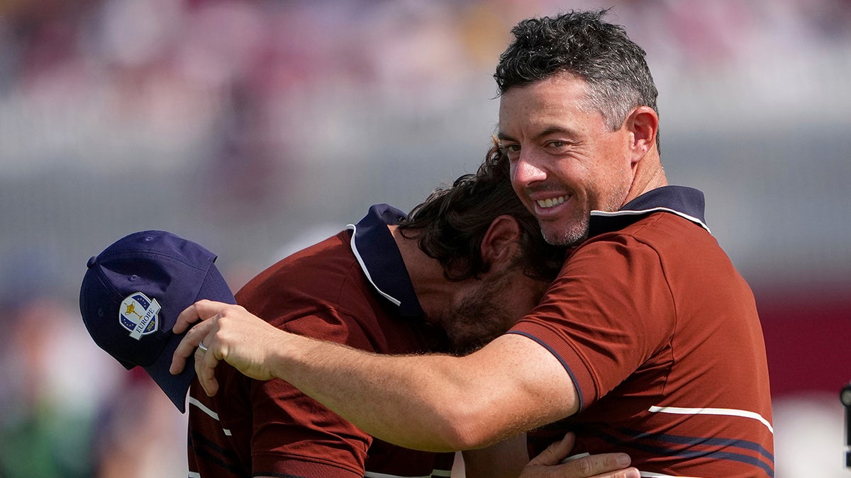 Rory McIlroy and Tommy Fleetwood embrace