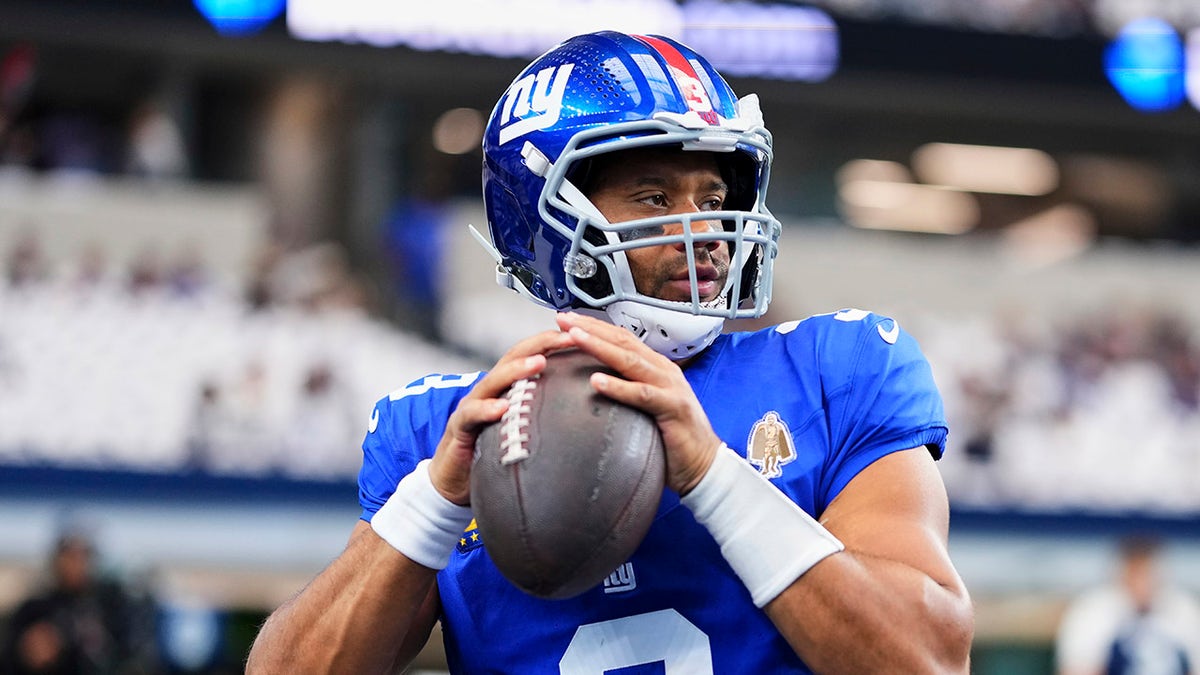 Russell Wilson looks to pass