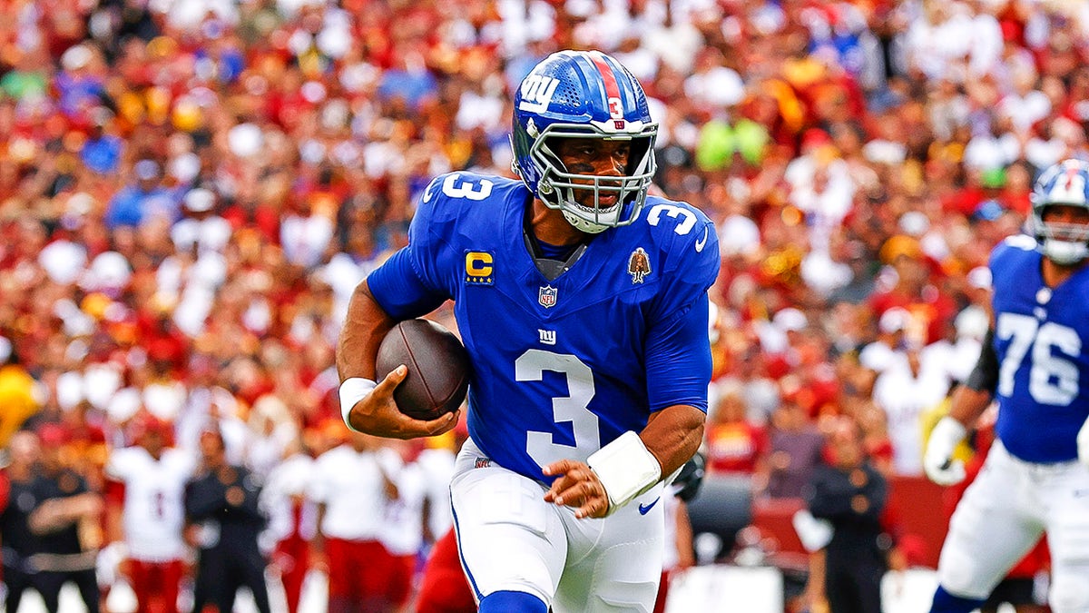 Russell Wilson runs with the ball
