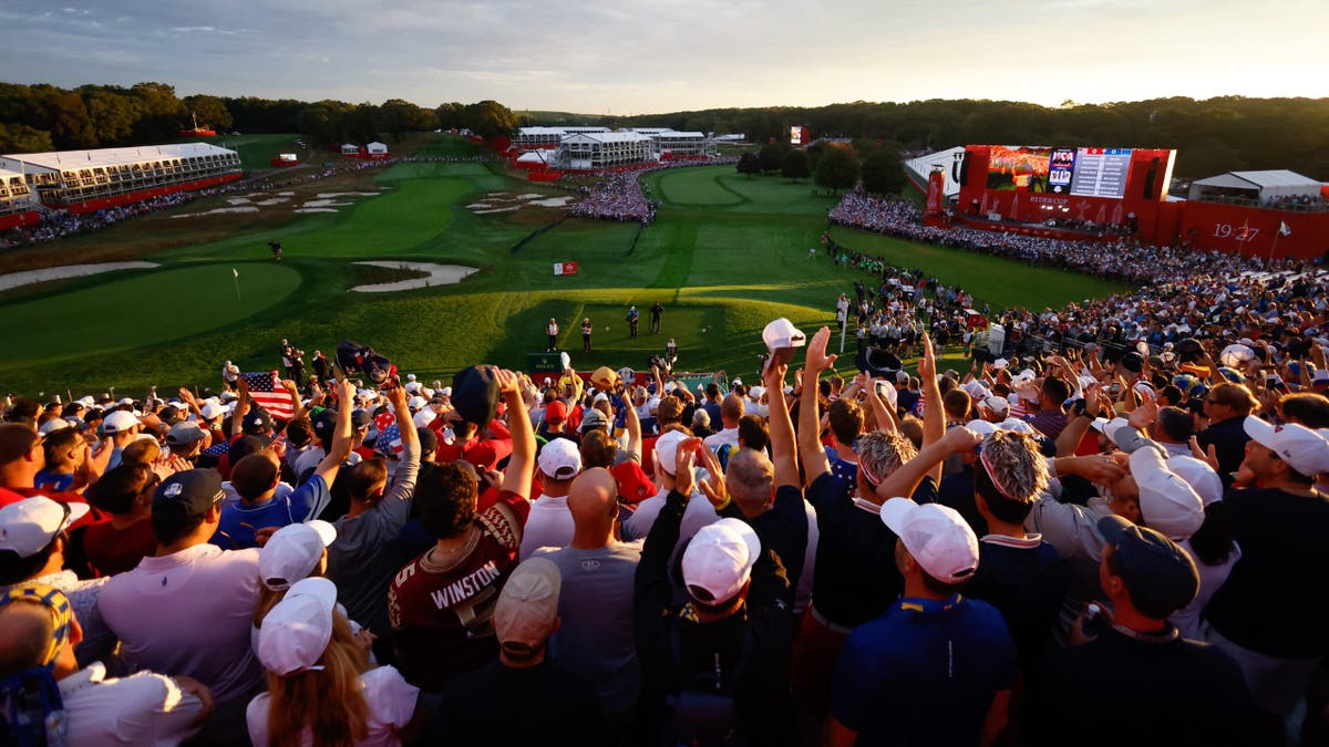 Fans wait at the first tee for the start of Ryder Cup competition at Bethpage Black.