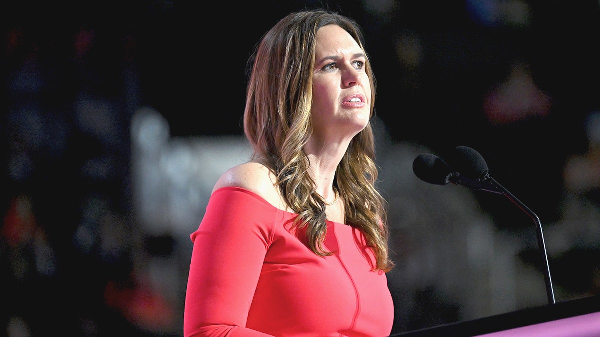 Gov. Sarah Huckabee Sanders speaks at a podium at the RNC