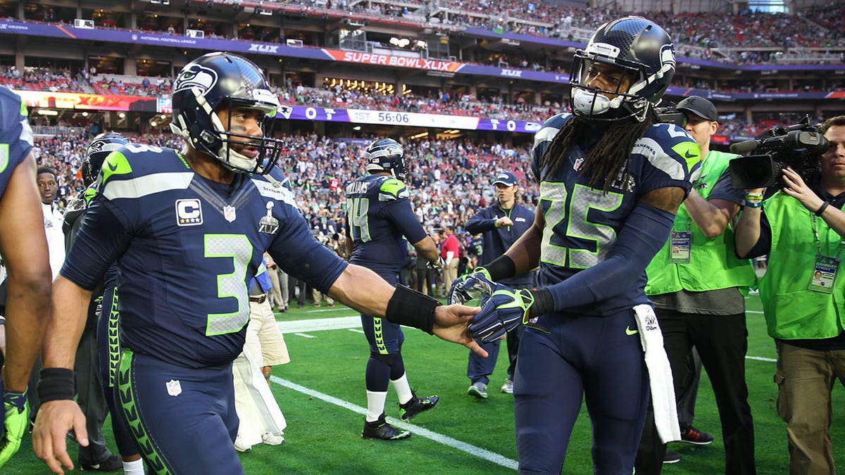Russell Wilson and Richard Sherman shake hands