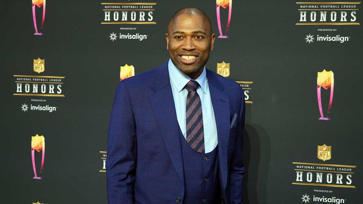Shaun Alexander smiles at NFL Honors