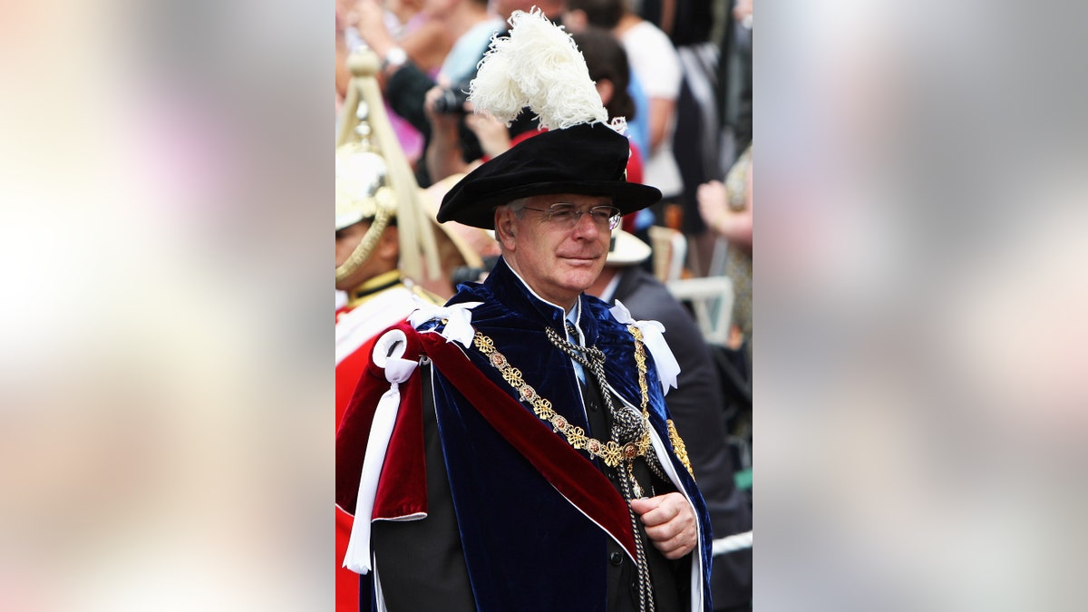Sir John Major wearing grand robes after receiving knighthood.