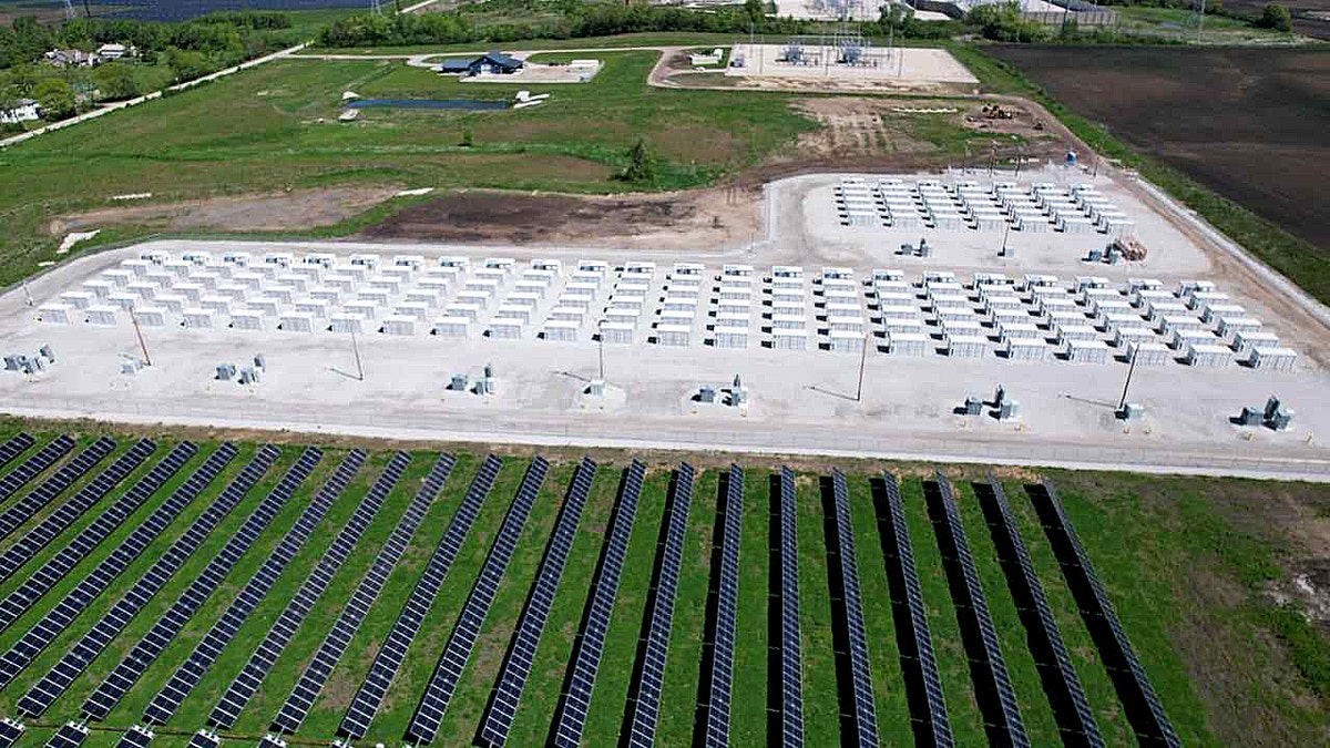 Wide aerial view of Wisconsin’s Paris Solar-Battery Park with solar fields and battery storage units.