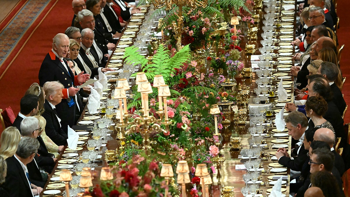 A lavish state banquet dinner being held at Windsor Castle.