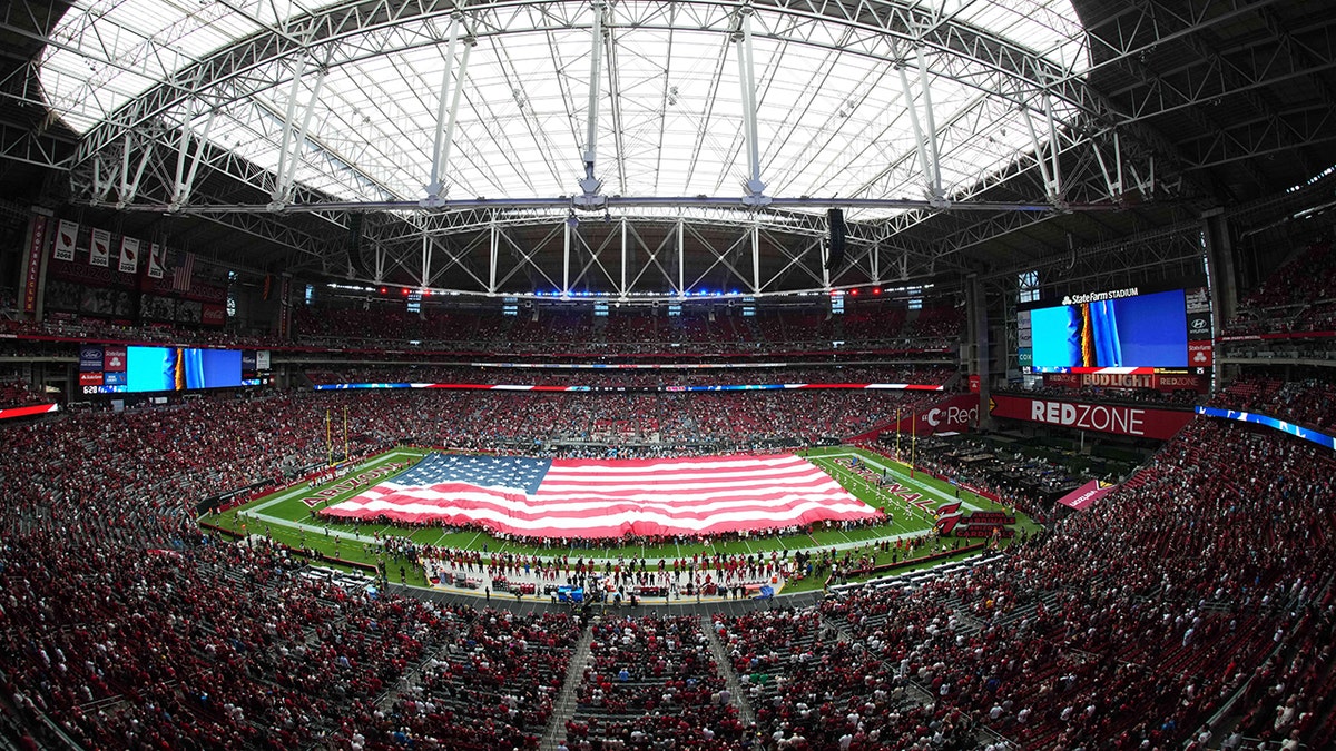 State Farm Stadium in Glendale, Arizona with American flag on field