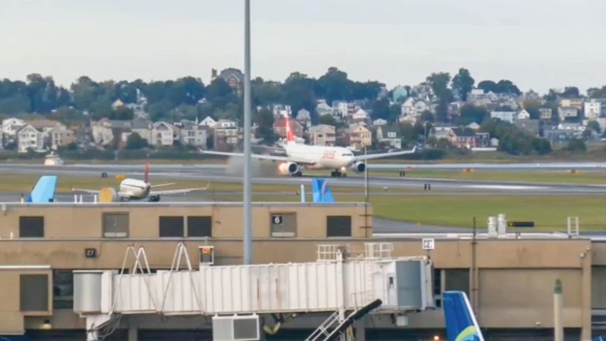 Flames shoot out of an airplane