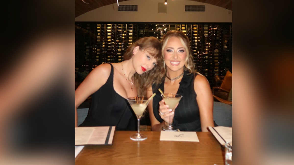 Taylor Swift and Brittany Mahomes smile at dinner