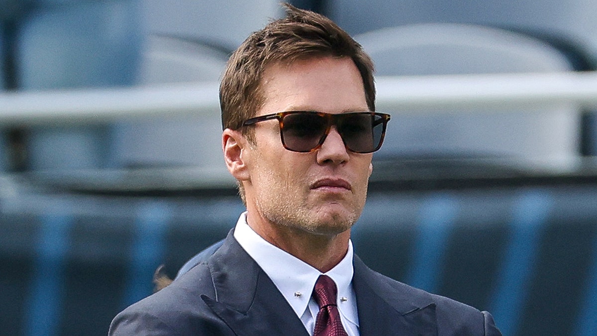 Tom Brady looks on field