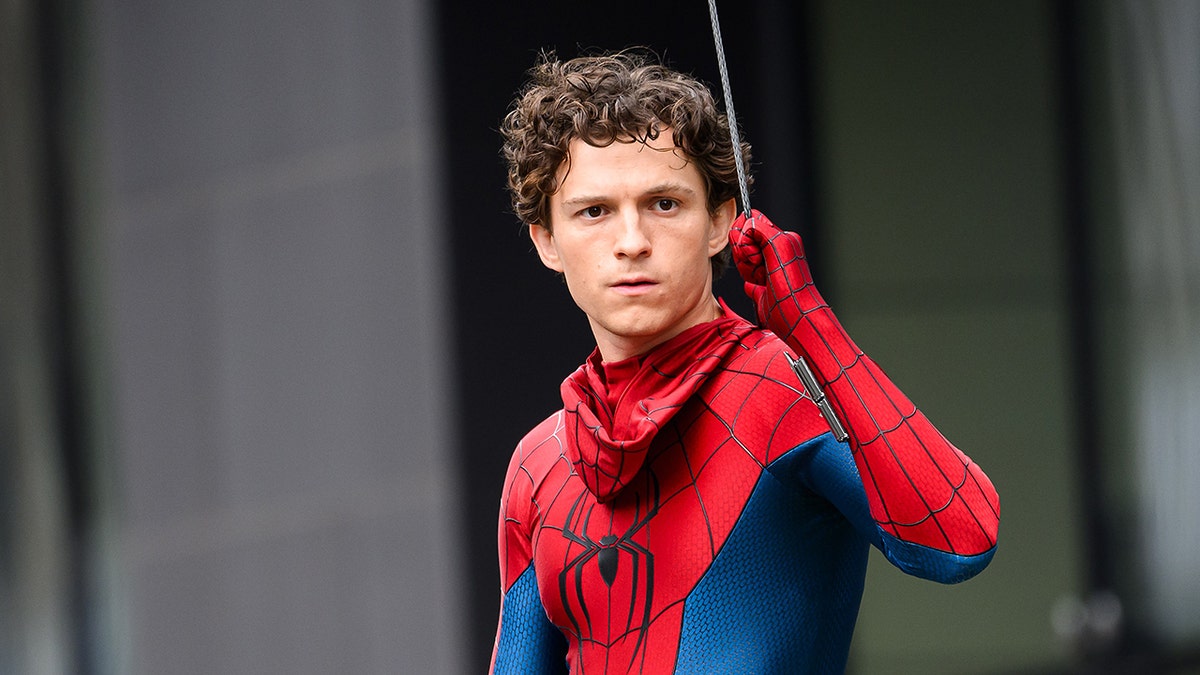 Tom Holland in Spiderman costume.