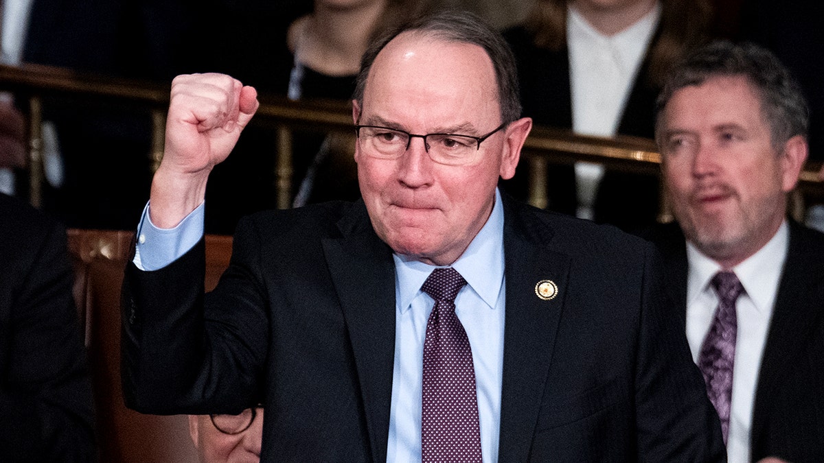 Rep. Tom Tiffany holds up a fist