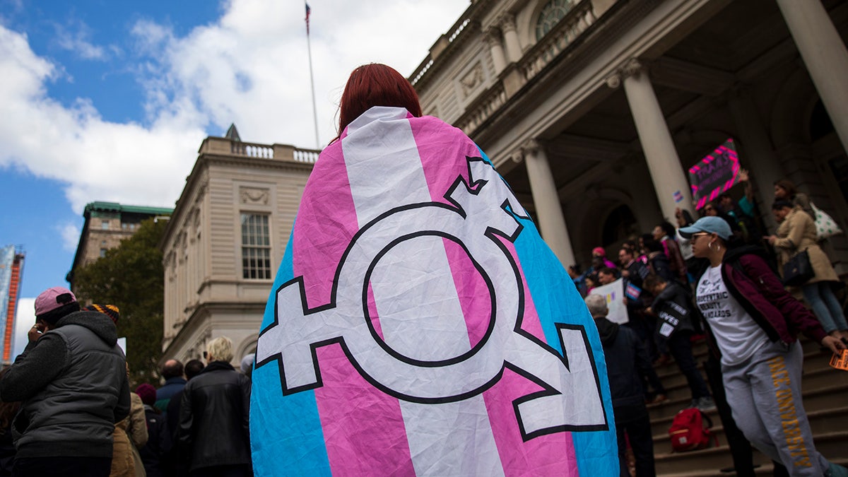 transgender activist with flag