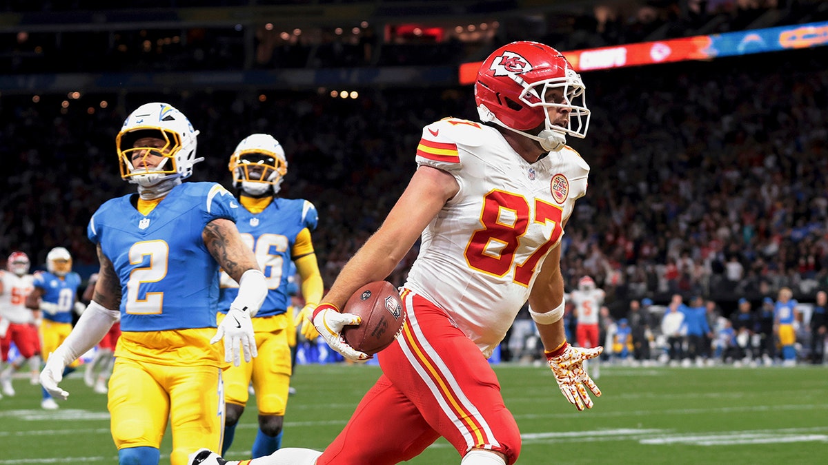 Travis Kelce celebrates after scoring